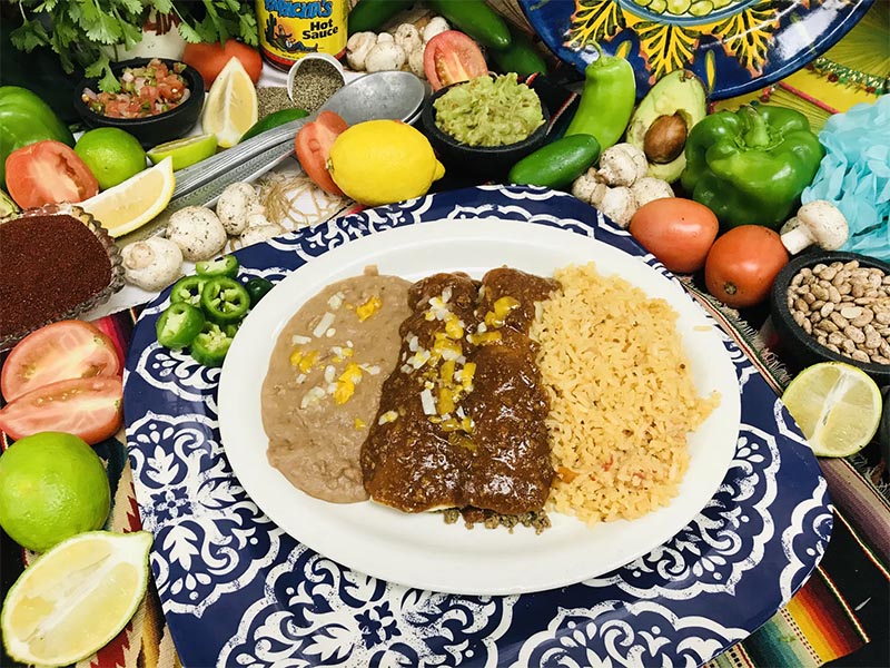 Enchiladas, rice and beans